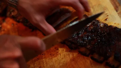 Cutting Barbecue Ribs Stock Footage 42429378