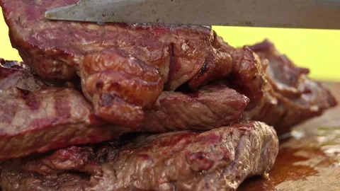 Cutting barbecue steak fried on the grill Stock-Footage 245478370