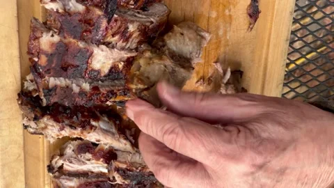 Cutting bbq ribs from overhead Stock Footage 223182113