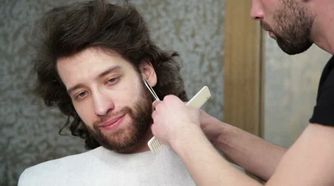 Cutting  beard with the scissors and the comb Stock Footage 62979081