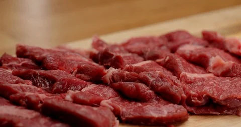 Cutting beef with chef knife close up, cooking process Stockbeeldmateriaal 126258022