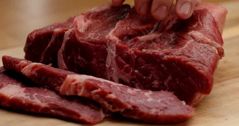 Cutting beef with chef knife close up, cooking process Stock Footage 126258277