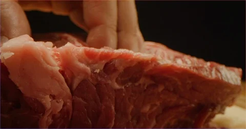 Cutting beef with chef knife macro shot Video stock 126292935