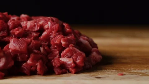 Cutting beef with chef knife macro shot, preparing ingredients for Tar Tar Stock Footage 128488034