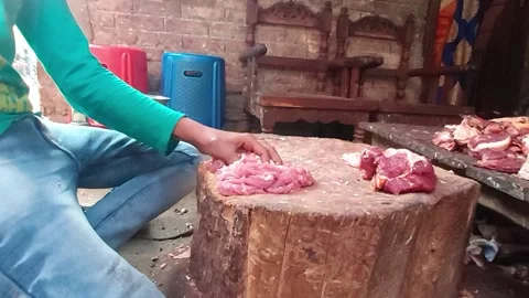 Cutting beef meat by young boy Stock Footage 194470361