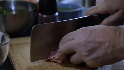 Cutting beef ribs with hatchet Stock Footage 120462405