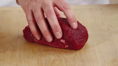 Cutting beef into thick slices Stock Footage 24654340