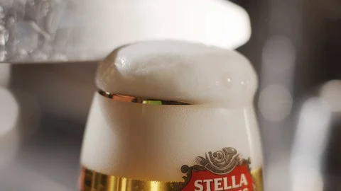 Cutting beer foam with a knife Stock Footage