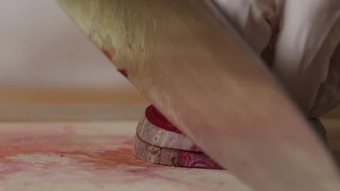 Cutting beet with chef knife macro shot, preparing ingredients for Tar Tar Stock-Footage 128490124