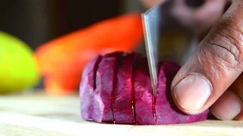 Cutting Beet by knife. Red Beetroot cutting to make salad 動画素材 137029438