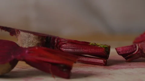 Cutting beet with sharp chef knife macro shot, preparing ingredients for Tar Tar Video stock 128488634