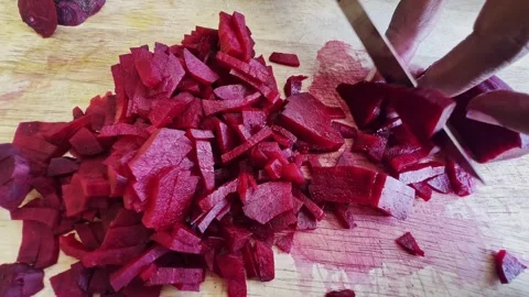 Cutting beet with sharp chef knife macro shot, cooking process, preparing Stock Footage 304484569