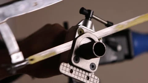 Cutting a bicycle fork metal steerer tube with a hacksaw blade close up Stock Footage 307453157