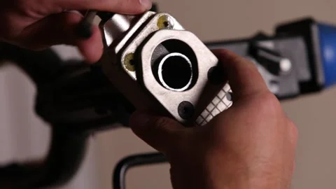 Cutting a bicycle fork metal steerer tube with a hacksaw blade close up Stock Footage 307453566