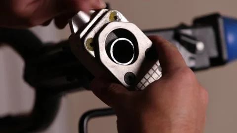 Cutting a bicycle fork metal steerer tube with a hacksaw blade close up Stock Footage 307454017