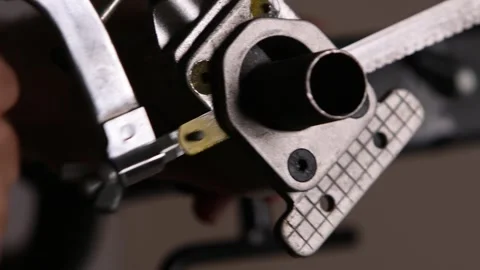 Cutting a bicycle fork metal steerer tube with a hacksaw blade close up Stock Footage 307454471