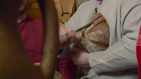 Cutting the Big Bread Loaf. Closeup Stock Footage 65434379