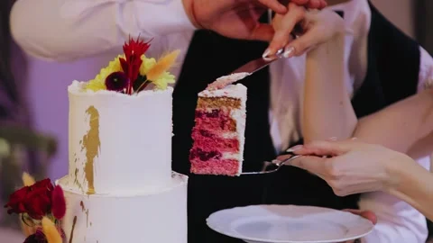 Cutting a birthday cake in the evening at an event. Close-up shooting. Stock Footage 305835368