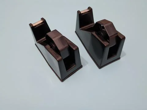 Cutting black plastic insulation Stock Photos
