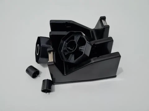 Cutting black plastic insulation Stock Photos
