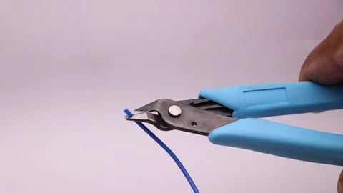 Cutting blue PLA Filament using Filament cutter. 3D Printer filament cutting Video stock 149640218