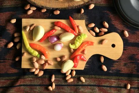 Cutting board and fresh vegetable ingredients Stock Photos