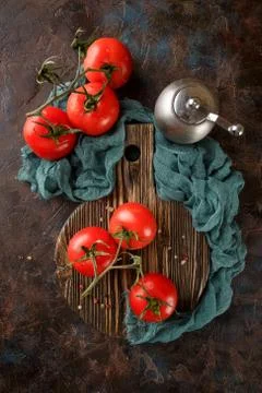 Cutting board with cherry tomatoes Stock Photos