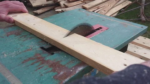 Cutting a board with a circular saw slow motion Stock Footage 195728400