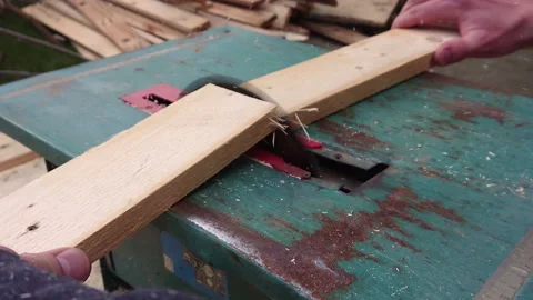 Cutting a board with a circular saw slow motion Stock Footage 195728415
