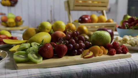 Cutting board filled with delicious fruit on kitchen counter, medium shot Stock Footage 341183958