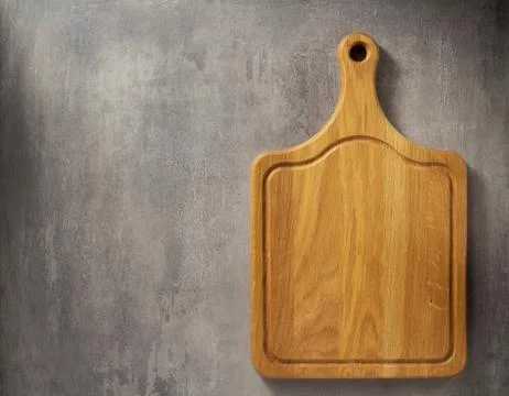 Cutting board at grey stone table Stock Photos
