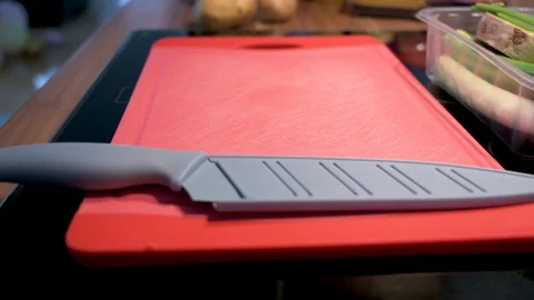 Cutting board with knife in close-up Stock Footage 124678099