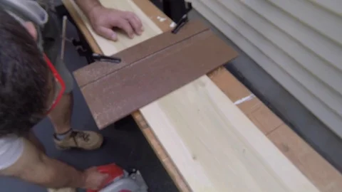 Cutting board to length with circular saw Stock Footage 81714528