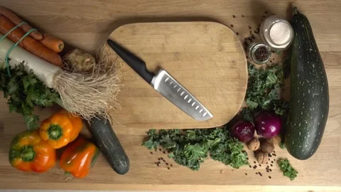 Cutting board top view. The man puts down and takes the knife. Stock Footage 141648880