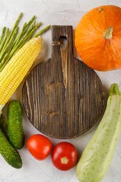 Cutting board with vegetables Stock Photos