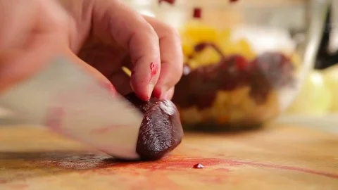 Cutting boiled beetroot on a wooden board Stock Footage 75408047