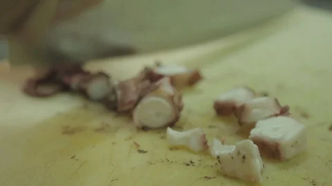 Cutting boiled octopus in pieces Stock Footage 88440740
