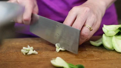 Cutting Bok Choy With A Large Knife Stock Footage 232970864