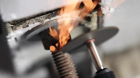 Cutting Bolt with Rotary Tool with sparks flying toward camera closeup 4K 60p00 Stock Footage 286293035