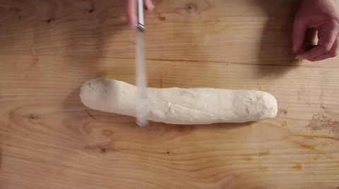 Cutting bread dough into eight peices Stock Footage 64023399