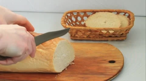 Cutting bread Stock Footage 21439118