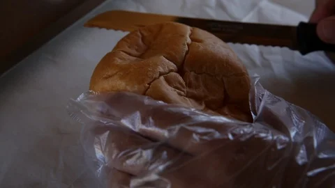 Cutting bread Stock Footage 90554070