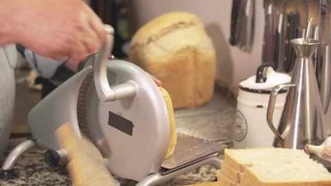 Cutting bread in kitchen Stock-Footage 331571383