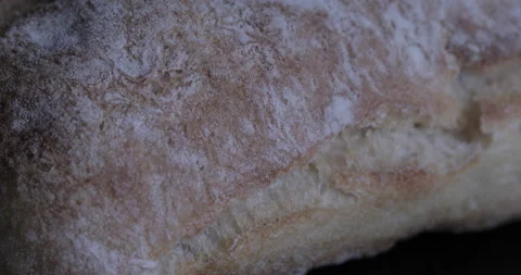 Cutting bread with a knife Stock Footage 130999605