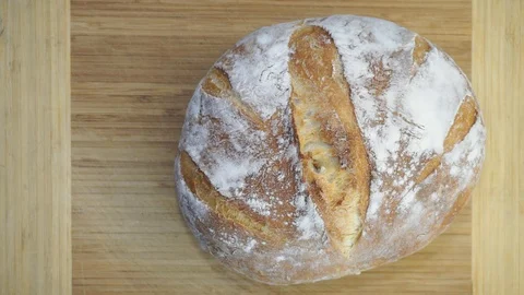 Cutting bread overhead Stock Footage 121120334