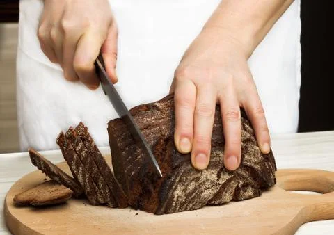 Cutting bread Stock Photos