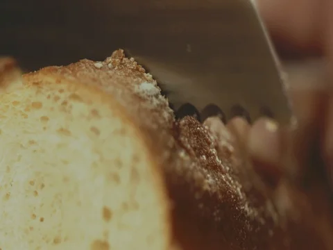 Cutting bread into slices Stock Footage 76602527