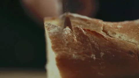 Cutting bread into slices Stock Footage 76602567