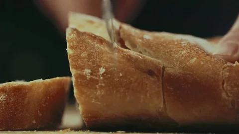 Cutting bread into slices Stock Footage 76602576