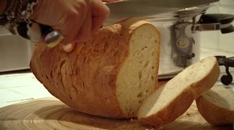 Cutting bread on the table. Food in Italy. Stock Footage 59644353